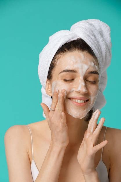 Premium Photo Beauty Treatment Woman Applying Facial Cleaning Foam