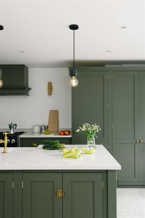 Therefore the darker the tone of green on the cabinets the lighter the colour should be on the floors to create add a sense of balance. The Best in Dark Green Kitchen Trends - Town & Country Living
