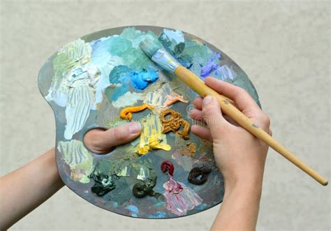 Artists Hands Holding A Paint Brush And Palette Stock Image Image Of