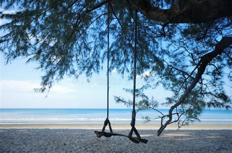 Pretty Girl On Swing With Backgound Of Nang Thong Beach In Khao Lak Lighthouse Stock Image