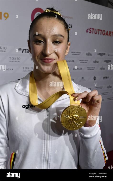 Belgian Gymnast Nina Derwael Celebrates With Her Gold Medal At The Podium Ceremony After The