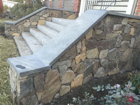 Wide Granite Steps Bluestone Caps Atop Stone Veneered Side Walls