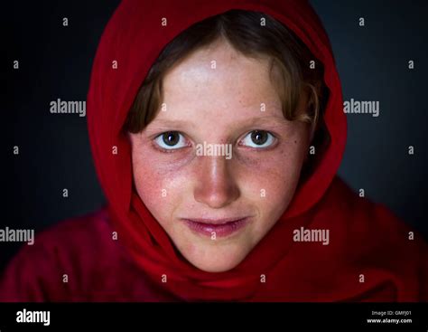Portrait Of An Afghan Girl With Pale Skin Wearing Red Clothes