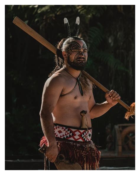 A Māori warrior performs the haka at a welcoming ceremony at the Tamaki