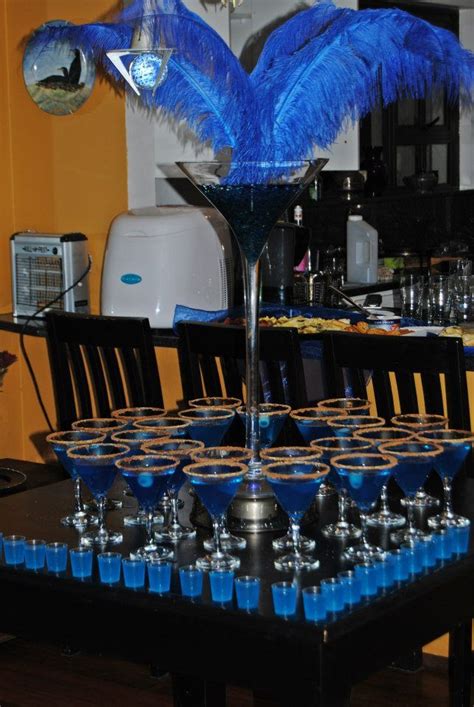 The most magical party theme of all! blue cocktail decor. cocktail party. martini glasses ...