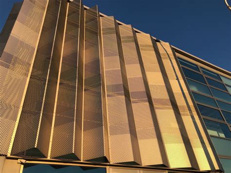 Folded Perforated Panels Provide Shade And Look Great Metal Facade