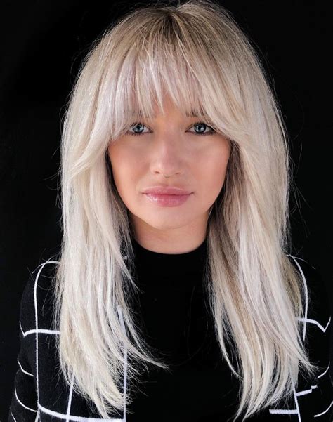 messy wavy hair blonde hair with bangs soft bangs platinum blonde bangs blonde bob with
