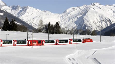 Switzerland's numerous mountains are to a great extent vegetated by thick woodlands, which mostly consist of pines, firs, spruces and larches. Passenger train in the snow in Switzerland wallpapers and images - wallpapers, pictures, photos