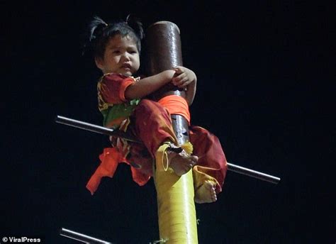 Two Year Old Girl Is Tied To A Pole Before Being Dangled Upside Down