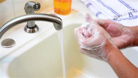 Washing Hands Under A Faucet Stock Footage Video 4574351 Shutterstock