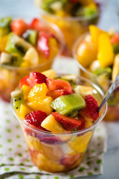 Fruit Salad In Small Plastic Cups With Spoons On The Side Ready To Be