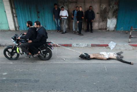 Video Men Drag Body Of Israeli Spy Through Gaza Streets The