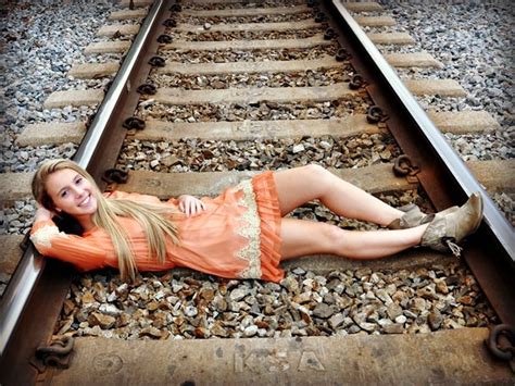 Railroad Track Photo Shoot Girl Wearing Dress And Boots Poses On