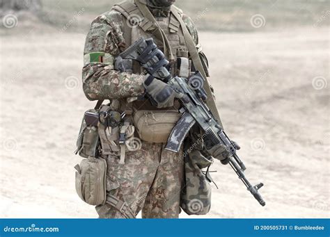 Soldier With Assault Rifle And Flag Of Zambia On Military Uniform