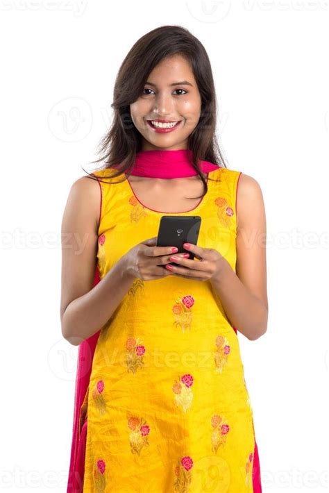 Young Indian Girl Using A Mobile Phone Or Smartphone Isolated On A White Background 5050933