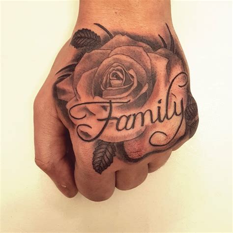 Tattoos on the hand can be single letters, words that move with the sinews, a design on a finger, or any number of other things. Rose hand tattoo with the word family. #rosetattoo # ...