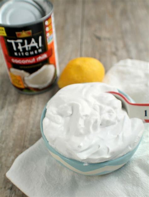 A Bowl Of Whipped Cream Next To A Can Of Yogurt