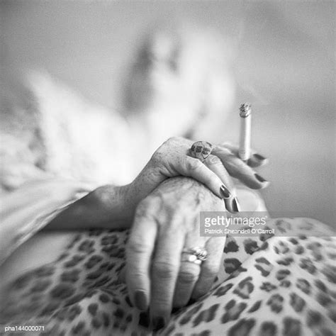 Mature Woman Smoking Cigarette Photos And Premium High Res Pictures