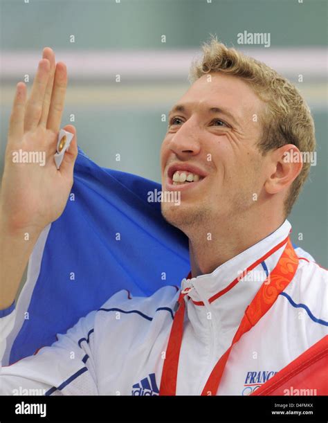 Alain Bernard Of France Celebrates His Gold Medal After The Mens 100m