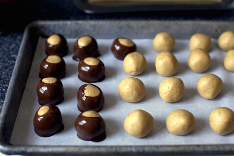 Buckeyes are a confection made from a peanut butter fudge partially dipped in chocolate to leave a circle of peanut butter visible. Buck Eye Truffle : Buckeyes Recipe Food Network - Bought ...