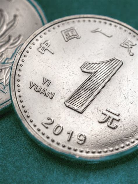 1 Chinese Yuan Coin On A Blue Green Backdrop Close Up Stock Image