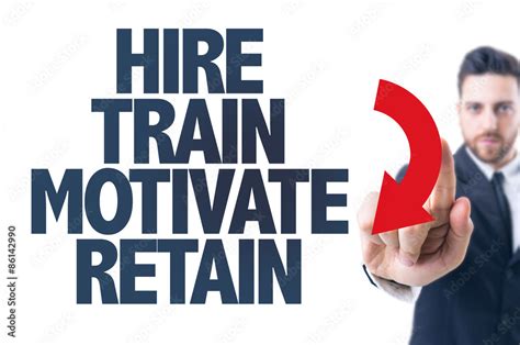 Business Man Pointing The Text Hire Train Motivate Retain Stock 写真