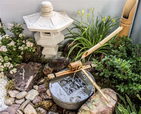 Shishi Odoshi Japanese Bamboo Water Fountain In Zen Garden Stock Photo