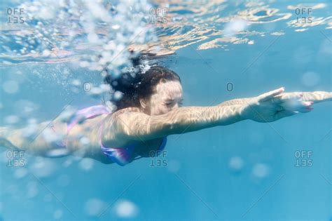 Underwater View Of Woman In Bikini Swimming Stock Photo OFFSET