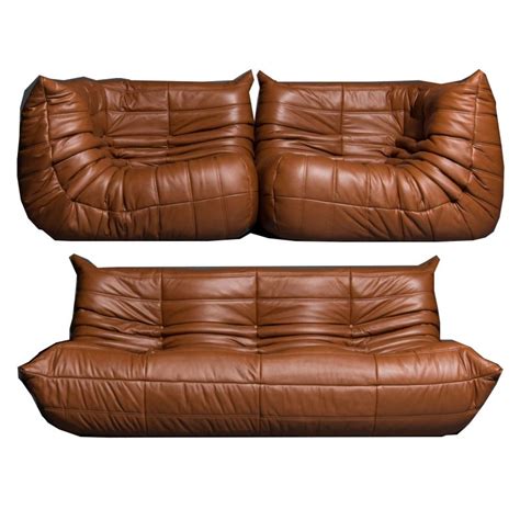 In the case of living rooms, media rooms, family rooms or in the case of any other type of room. Set of 3 vintage "Togo" sofa in leather by Ligne Roset ...