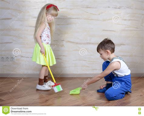 Cute Children Using Toy Broom And Dustpan Stock Photo Image Of