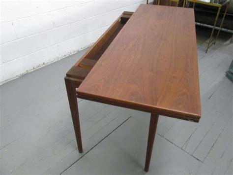 Table folds out from a 20d laptop desk/console to a 40 sq. Jens Risom Convertible Dining Table or Console For Sale at ...