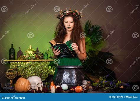 Witch With Disheveled Hair And Long Nails With A Wreath Of Dry Branches On Her Head Dressed In