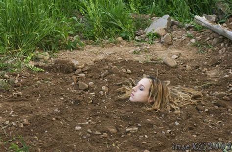 Women Buried Up To Her Neck In The Ground Dirt How To Dry Basil