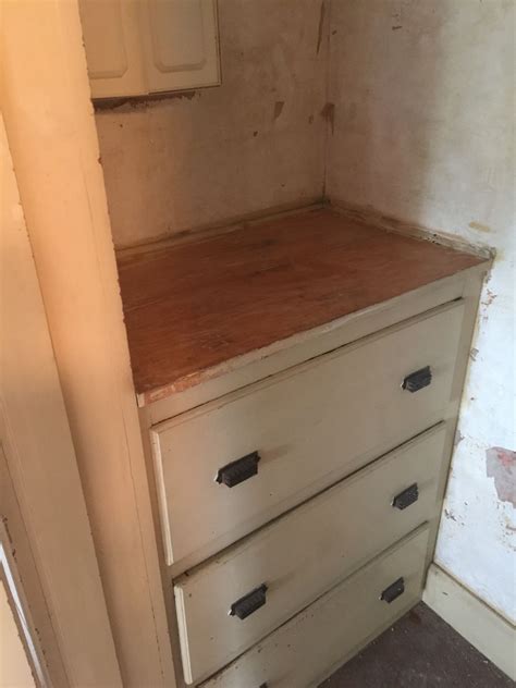 Built In Closet Cabinets In Process Of Removing Old Paint Off The Top