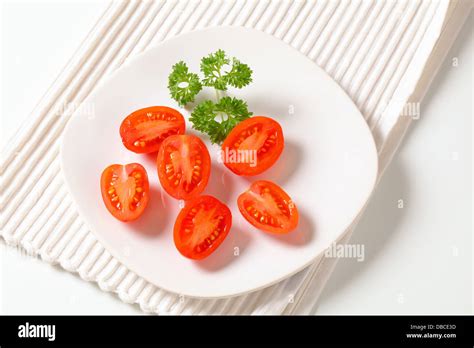 Red Plum Tomatoes Cut Into Halves Stock Photo Alamy
