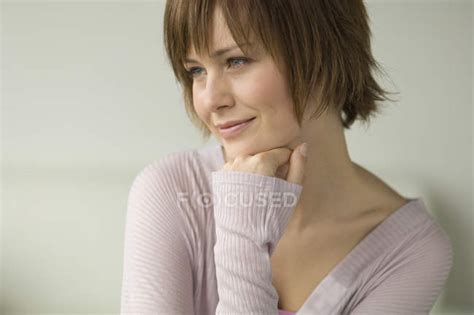 Portrait Of Smiling Woman With Short Hair Looking Away — Head And