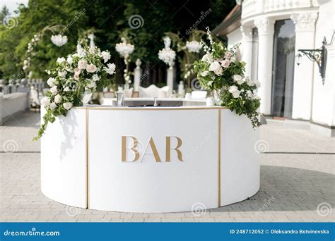 Bar Counter Decorated With Flowers At A Wedding Party Stock Photo