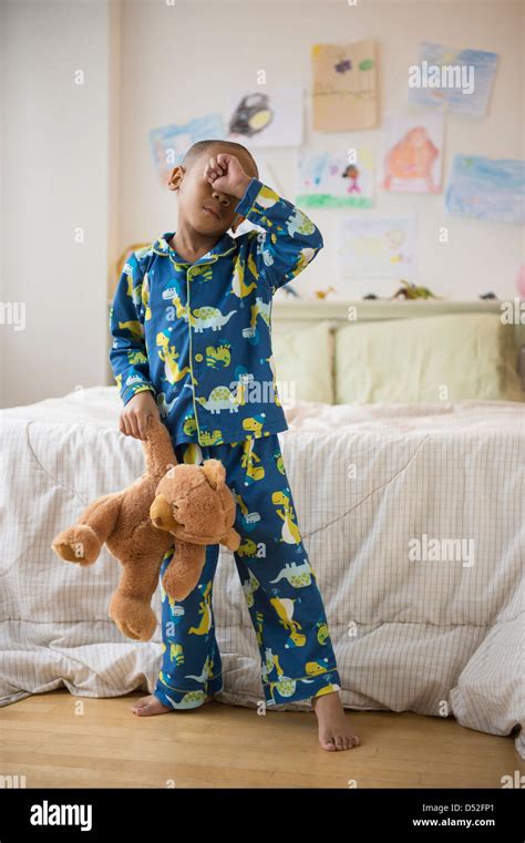 African American Boy Waking Up In Bedroom Stock Photo Alamy