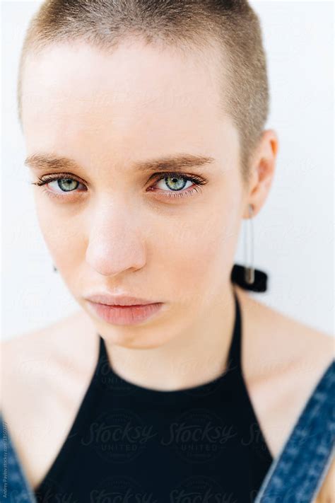 Close Up Portrait Of A Stylish Woman With Crewcut Looking At Camera By