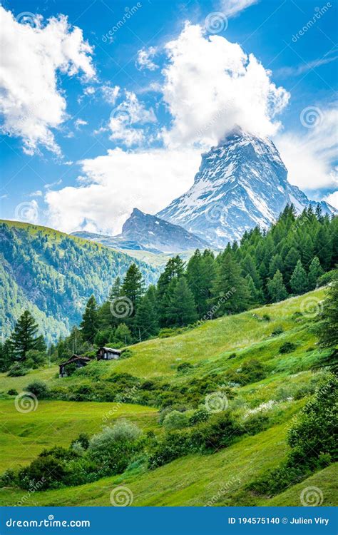 Vertical Scenic View Of The Matterhorn Mountain Summit With Snow Clouds