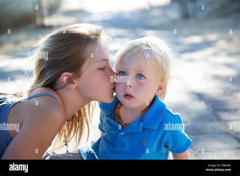 Brother Kissing His Sister On The Cheek Hi Res Stock Photography And