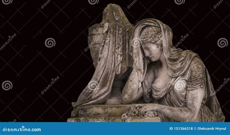 Old Stone Sculpture Of Sad Woman In Grief Virgin Mary Stone Statue Isolated On Black Stock