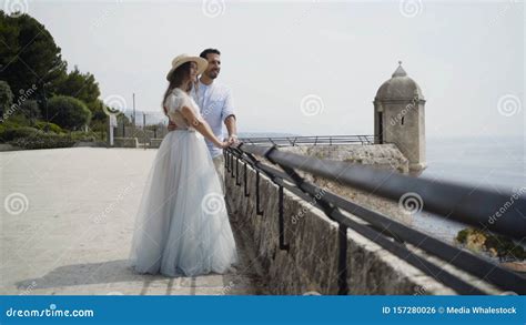 Beautiful Young Couple On Honeymoon Action Newlyweds On Stone