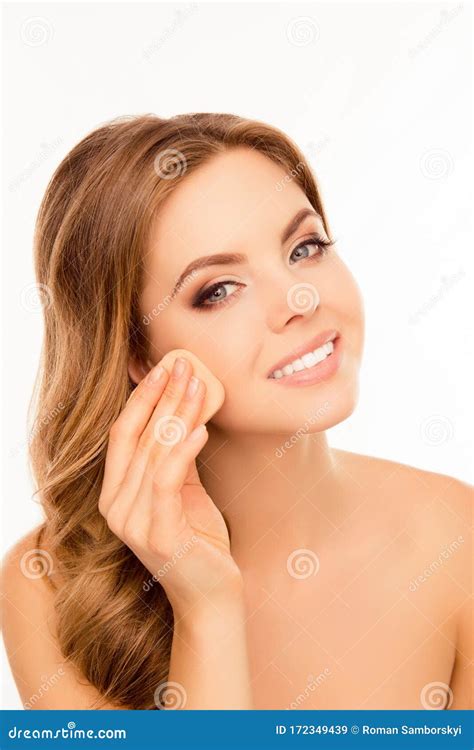 Portrait Of Smiling Woman Evening Skin Tone With Sponge Stock Image