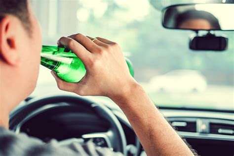 Drunk Man Driving A Car On The Road Holding Bottle Beer Dangerous Drunk Driving Concept Stock