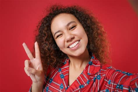 Close Up Of Blinking Young African American Girl In Pajamas Homewear Resting At Home Isolated On