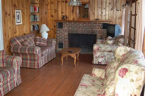 Deck overlooks river, new memory foam beds ,air cond. Another of the three living room areas with wood burning ...