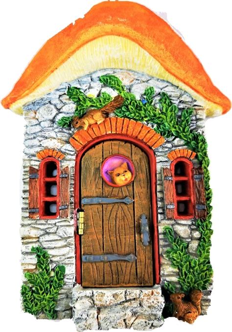 Glue on rocks and bark… done and done. Squirrel Cottage Opening Fairy Door | Away with the Fairies