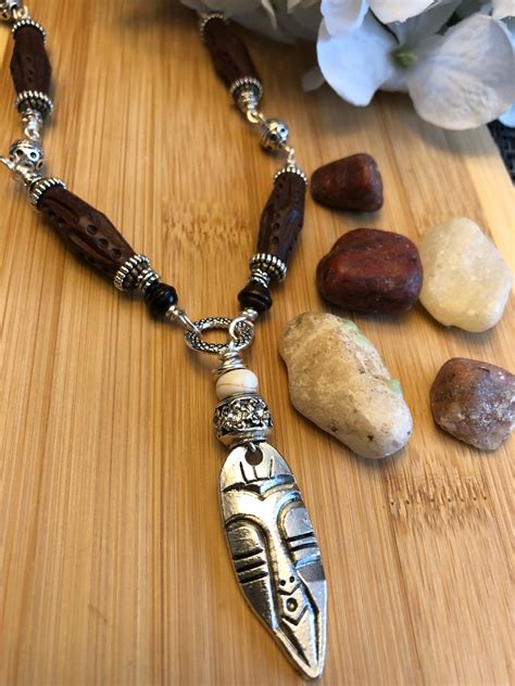 dbc-tribal-charm-necklace-with-wood-bead-accents-by-cyerescloset-on-etsy-tribal-pendant