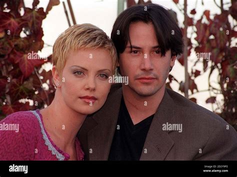 Actress Charlize Theron Left With Keanu Reeves At A Photocall In London Today Thursday To